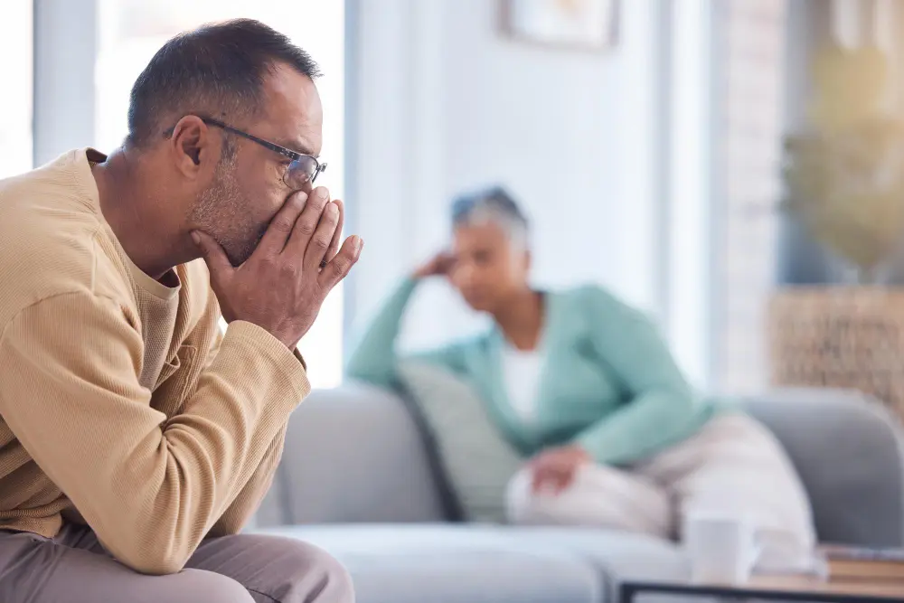 Thinking divorce and old couple with financial stress money problems or fighting about mortgage bills at home divorce depression or frustrated old man with a senior partner after argument on sofa, TMS for Anxiety